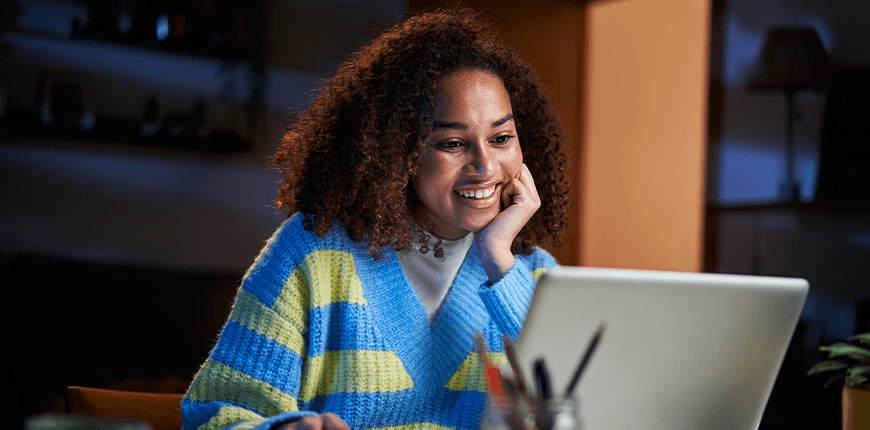 Woman on laptop completing online course
