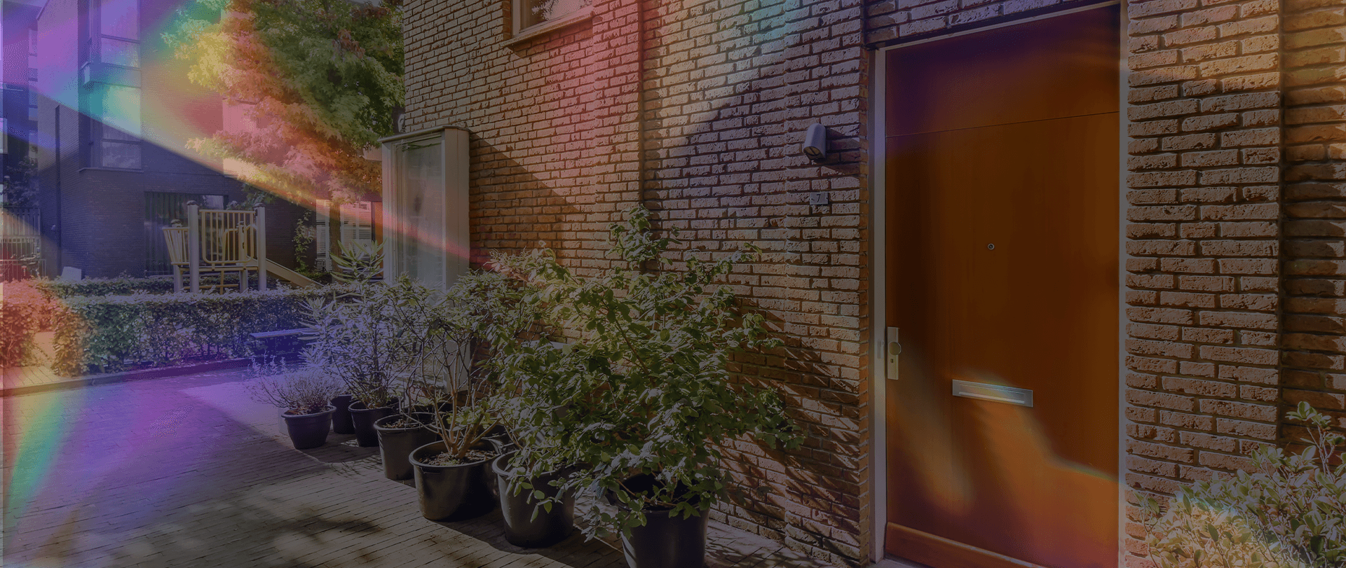 Outside the front door of a home with vivid lights